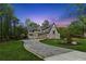 Exterior view of a charming home with well-maintained landscaping at 100 Maison Ct, Roswell, GA 30076