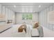 Cozy living room with white carpet, comfortable seating, and natural light at 100 Maison Ct, Roswell, GA 30076