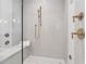 Walk-in shower featuring subway tile surround, a shower bench, and bronze fixtures at 100 Maison Ct, Roswell, GA 30076