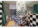 A unique black-and-white checkered bathroom features a modern vessel sink and a classic design at 1130 Piedmont Ne Ave # 1407, Atlanta, GA 30309