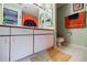 Bathroom featuring a double sink vanity, ample storage, and tiled floors at 1130 Piedmont Ne Ave # 1407, Atlanta, GA 30309