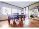 Sunlit dining area featuring a large window with city views and hardwood flooring at 1130 Piedmont Ne Ave # 1407, Atlanta, GA 30309