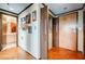 Hallway with hardwood floors, multiple doorways, and decorative wall art at 1130 Piedmont Ne Ave # 1407, Atlanta, GA 30309