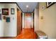 Hallway with hardwood floors, multiple doorways, and decorative wall art at 1130 Piedmont Ne Ave # 1407, Atlanta, GA 30309