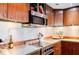 Modern kitchen with stainless steel appliances and granite countertops at 1130 Piedmont Ne Ave # 1407, Atlanta, GA 30309