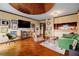 Stylish living room with hardwood floors, comfortable seating, and a unique decorative ceiling at 1130 Piedmont Ne Ave # 1407, Atlanta, GA 30309