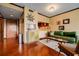 Bright living room with hardwood floors, comfortable green sofa, and wet bar at 1130 Piedmont Ne Ave # 1407, Atlanta, GA 30309