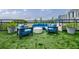 Urban rooftop terrace with artificial turf, modern seating, planters, and cityscape views at 1130 Piedmont Ne Ave # 1407, Atlanta, GA 30309