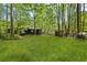 Backyard view of home showcasing the grassy area at 3541 Hutcheson Ferry Rd, Whitesburg, GA 30185