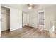 The home's bedroom features wood-look floors and white walls with a connecting bathroom and closet at 3541 Hutcheson Ferry Rd, Whitesburg, GA 30185