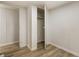 Bedroom features wood-look flooring and a closet for easy storage, as well as a fresh coat of paint at 3541 Hutcheson Ferry Rd, Whitesburg, GA 30185
