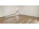 The living room features wood-look flooring, fresh paint, and easy access to other parts of the home at 3541 Hutcheson Ferry Rd, Whitesburg, GA 30185