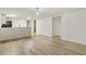 Living room with laminate wood floors, white walls and open floor plan at 3541 Hutcheson Ferry Rd, Whitesburg, GA 30185