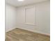 This small room features wood-look flooring and fresh paint for a clean, neutral design at 3541 Hutcheson Ferry Rd, Whitesburg, GA 30185