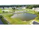 Aerial view of the community ponds with manicured lawns and sidewalks that connect the area at 4143 Halton Rd, Duluth, GA 30097