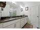 Bathroom featuring double sink vanity, tiled floors, and walk-in glass shower at 4143 Halton Rd, Duluth, GA 30097