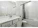 Bathroom features white single sink vanity, tiled floors, and shower-tub combo at 4143 Halton Rd, Duluth, GA 30097
