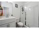 Bathroom with modern glass enclosed shower, a white vanity and subway tile, offering a clean, fresh design at 4143 Halton Rd, Duluth, GA 30097