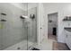 Bathroom features a large walk-in glass shower with light gray tiling and shelves at 4143 Halton Rd, Duluth, GA 30097