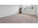 Empty bedroom with plush carpeting, natural light, and a serene atmosphere, ready for personal touches at 4143 Halton Rd, Duluth, GA 30097