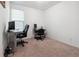 Bedroom featuring neutral walls, carpet flooring, and work-from-home setup at 4143 Halton Rd, Duluth, GA 30097