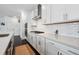 Modern kitchen featuring white cabinets, subway tile backsplash, stainless steel appliances, and quartz countertops at 4143 Halton Rd, Duluth, GA 30097