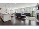 Spacious open-concept living room featuring wood floors and natural light, great for entertaining and relaxation at 4143 Halton Rd, Duluth, GA 30097