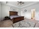 Spacious main bedroom features tray ceilings, carpet, ceiling fan and en-suite bathroom at 4143 Halton Rd, Duluth, GA 30097