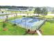 Aerial view of tennis courts with new fencing, lighting, and adjacent walking paths at 4143 Halton Rd, Duluth, GA 30097
