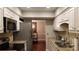 Galley style kitchen with granite countertops and stainless steel appliances at 1804 Huntingdon Chase # 1804, Atlanta, GA 30350