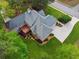 An aerial view shows the house, deck, driveway, and landscaping around the property at 2060 Pate Ridge Dr, Loganville, GA 30052