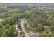 Aerial view pinpoints this home nestled among lush trees and landscaping in a serene neighborhood at 2060 Pate Ridge Dr, Loganville, GA 30052