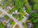 A bird's-eye view shows the home at a corner lot with mature trees and well-maintained landscaping at 2060 Pate Ridge Dr, Loganville, GA 30052