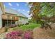 Backyard with a well-maintained lawn, mature trees, shrubbery and a wooden deck at 2060 Pate Ridge Dr, Loganville, GA 30052