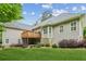 Exterior view of the house from the backyard, featuring well-manicured lawn and deck at 2060 Pate Ridge Dr, Loganville, GA 30052