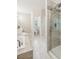 Bright bathroom featuring tiled walk-in shower, tub, and neutral color palette throughout the space at 2060 Pate Ridge Dr, Loganville, GA 30052