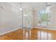 Bright foyer boasts gleaming hardwood floors, natural light from large windows, and a decorative chandelier at 2060 Pate Ridge Dr, Loganville, GA 30052
