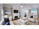 Inviting living room featuring a fireplace, hardwood floors, an open layout, and stylish decor at 2060 Pate Ridge Dr, Loganville, GA 30052