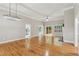 Spacious and bright living area featuring hardwood floors, stylish lighting, and an open floor plan at 2060 Pate Ridge Dr, Loganville, GA 30052