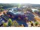 Aerial view of the building surrounded by lush greenery, roads, and trees at 2305 Whiting Bay Cts, Kennesaw, GA 30152
