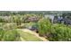 Aerial view of a beautiful property featuring a golf course and lake at 2305 Whiting Bay Cts, Kennesaw, GA 30152