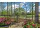 Beautiful backyard gate with landscaped garden and golf course view at 2305 Whiting Bay Cts, Kennesaw, GA 30152