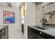 Bar area with elegant cabinetry, a sink, and custom mirror backsplash at 2305 Whiting Bay Cts, Kennesaw, GA 30152