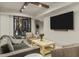Basement space with a large television, comfortable seating, a wine cellar, and modern lighting at 2305 Whiting Bay Cts, Kennesaw, GA 30152