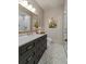 Beautiful bathroom with marble countertops, dark cabinetry, gold hardware, and a glass-enclosed shower at 2305 Whiting Bay Cts, Kennesaw, GA 30152