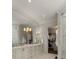 Well-lit bathroom featuring a large mirror, vanity and access to the closet at 2305 Whiting Bay Cts, Kennesaw, GA 30152