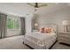 Tranquil bedroom featuring neutral tones, a plush bed, and natural light from the large window at 2305 Whiting Bay Cts, Kennesaw, GA 30152