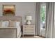Stylish bedroom featuring a comfortable bed, elegant nightstand and beautiful wall art at 2305 Whiting Bay Cts, Kennesaw, GA 30152