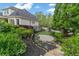 Well-maintained home with stone and siding exterior, lush landscaping and stone steps at 2305 Whiting Bay Cts, Kennesaw, GA 30152
