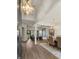 Grand foyer with hardwood floors, soaring ceilings, star chandelier, and open floor plan at 2305 Whiting Bay Cts, Kennesaw, GA 30152
